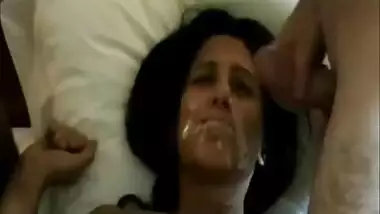 Hot brunette takes their cum on her face