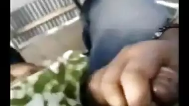 Indian girlfriend gives a blowjob on the balcony.