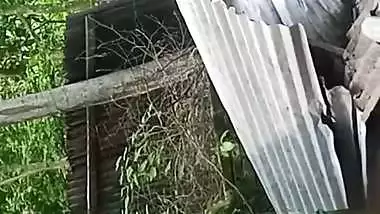 Village neighbor girl outdoor bath caught through hole