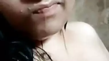 Indian girl showing boobs while bathing nude