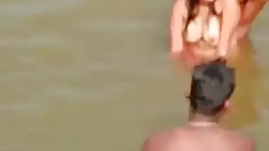 Desi girl enjoying river bath with group of boys