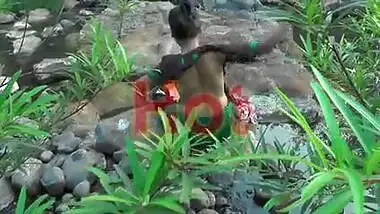 Young girl bathing in jungle showing hot bareback and cleavage