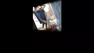 Indian village bhabhi nude during bath and recording by hidden cam