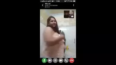 Mia on video call in bathroom