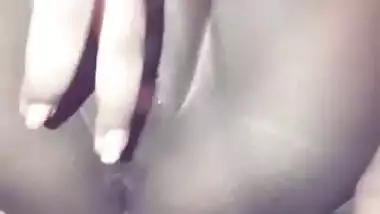 Showing her wet pussy