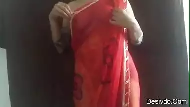 Hot & Sexy desi wife Simran Bhabhi showing boobs and ass in Red saree