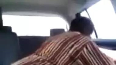 Tamil guy smooching and pressing boobs of cute girl in car