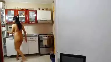 Desi MILF cooking nude in kitchen