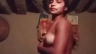 Village girl stripping and playing with bouncing boobs