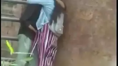 Outdoor Desi mms clip of Indian lovers caught making out by the wall