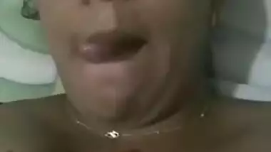 Indian aunty with sexy full lips takes big natural boobs out in bed