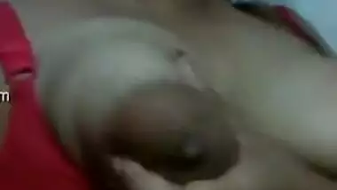 Eye-catching Indian girl has fun playing with sexy huge nipples