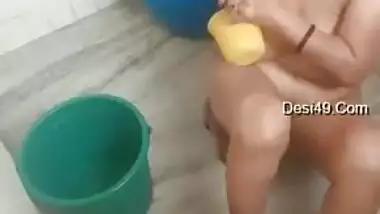 Indian aunty washes body focusing on boobs and muff in the bathroom